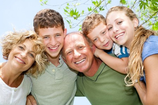 family with woman who has teeth whitening.jpg